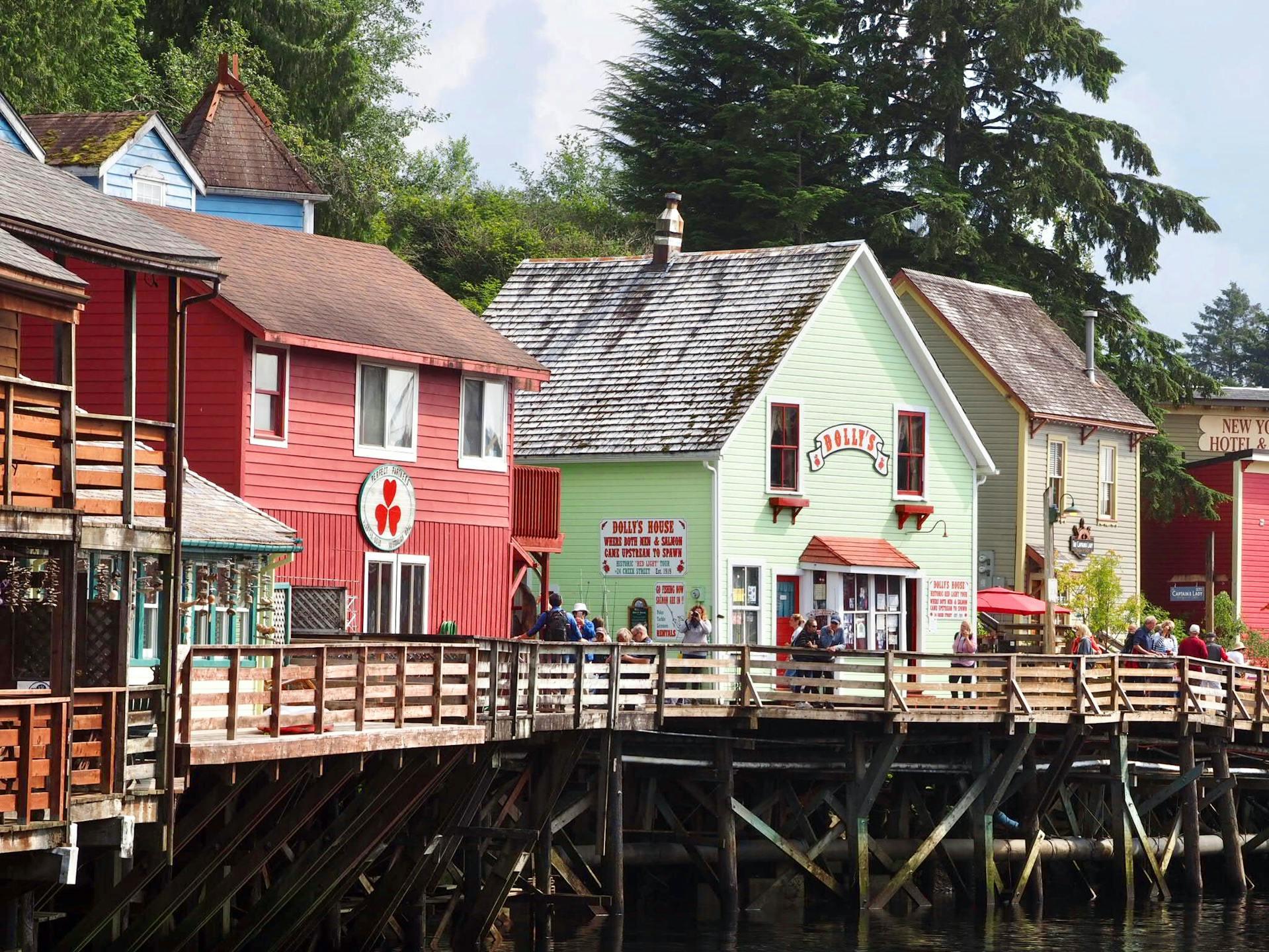 Photograph of Alaskan coastal buildring in red and pale green by photographer Tomon Cornelissen