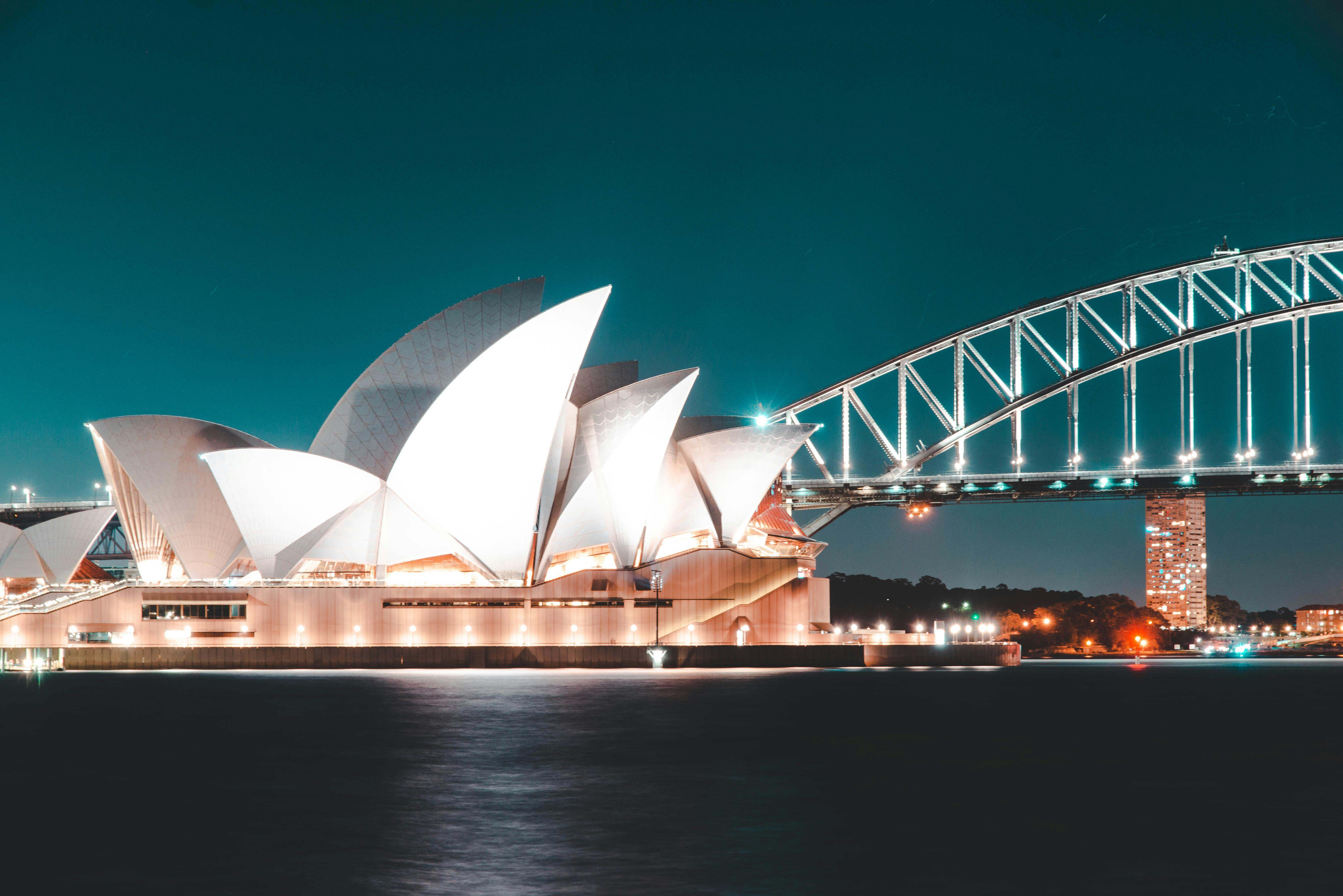 Photograph of the famous sydney opera house, as seen from the bay. Taken by photographer Rijan Hamidovic